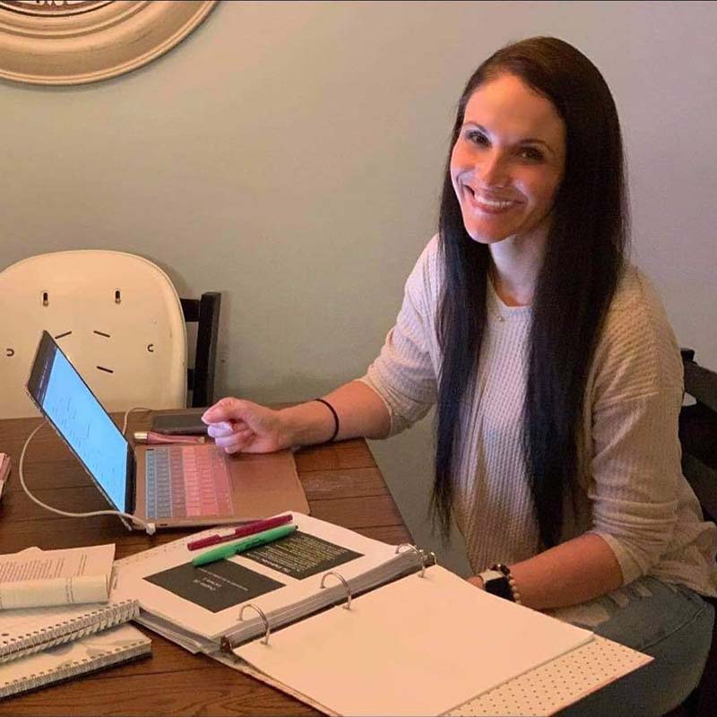 girl working on paper at desk